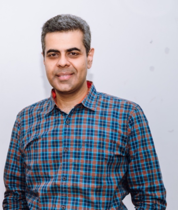 Portrait of a man in a blue checked shirt