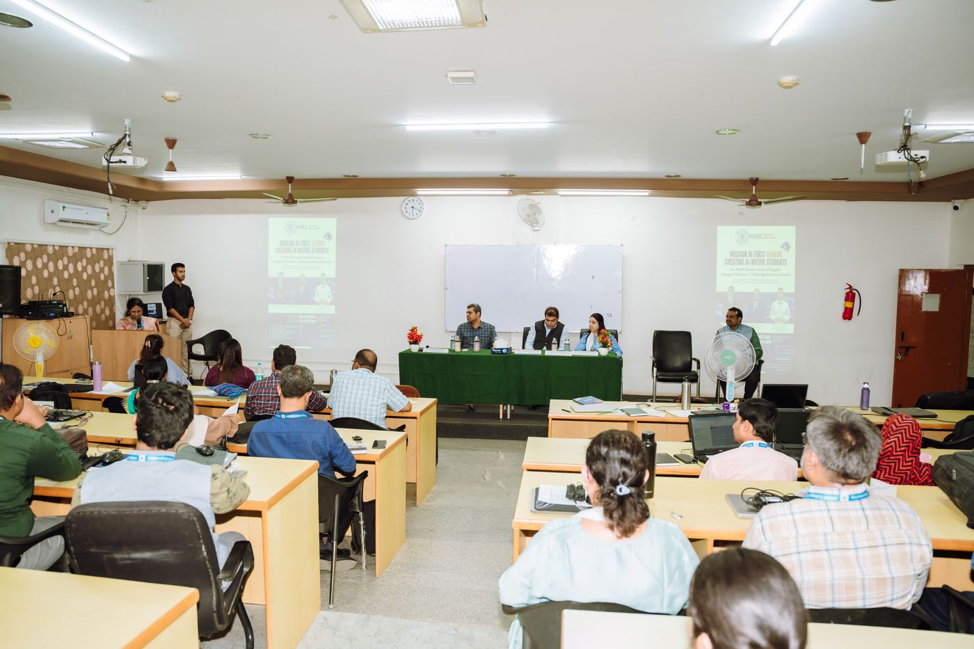 Panel and participants in the seminar hall